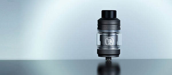 GeekVape Z Sub-Ohm SE Tank vape part with transparent glass and metal finish, featuring adjustable airflow and coil section.
